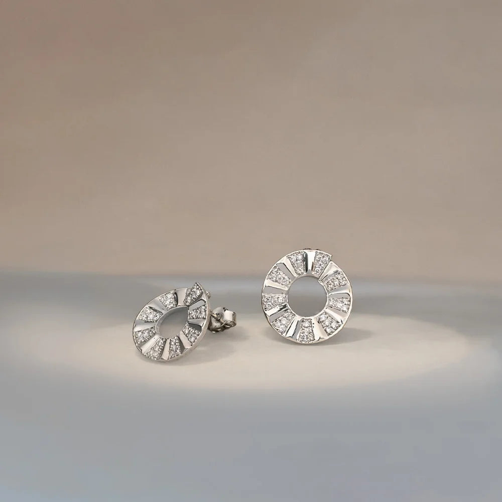 Unique statement earrings, silver circular studs with crystal accents