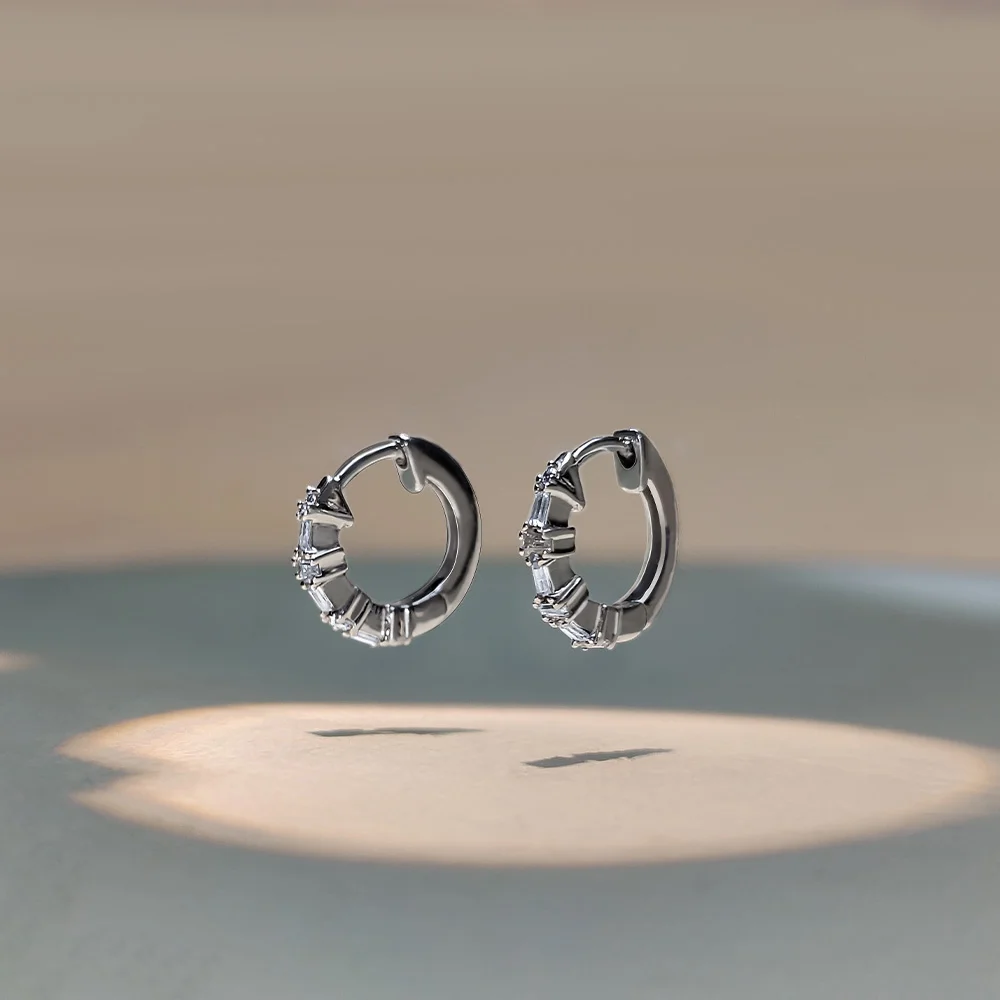 elegant silver hoop earrings with baguette diamond setting