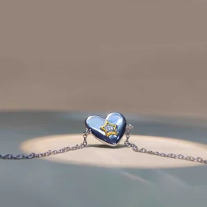 heart shaped diamond pendant with star setting in sterling silver